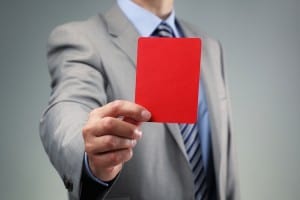 This image of a red card relates to the question of disqualification from City Hall service